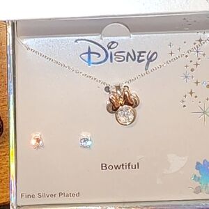 Minnie Mouse necklace a diamond studs.
